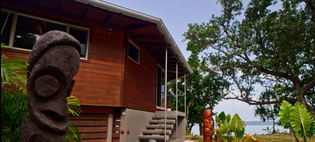 Lotus Private Island Villa exterior surrounded by tropical gardens at Exclusive Sunrise Resort Santo